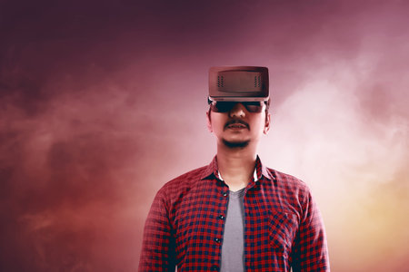 Young asian man wear VR headset get into virtual reality world