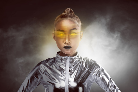 Pretty asian woman wearing latex jumpsuit. Inside cyber world conceptの写真素材