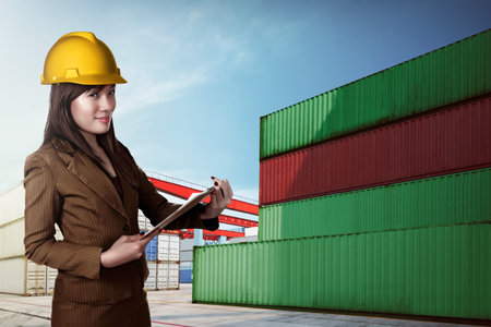 Asian business woman posing on the front of container