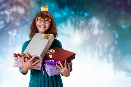 Asian woman smiling full of excitement, with a few gifts in her hands