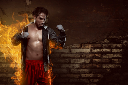 Muscular asian boxer man with sportswear when doing practicingの写真素材