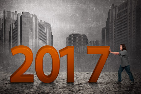 Asian people push 2017 number. Happy new year concept