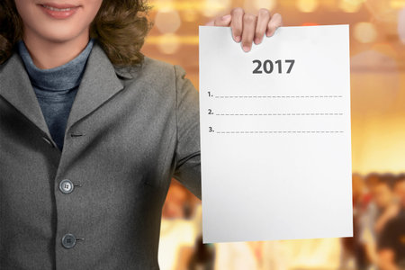 2017 to do list holding by business woman over blur background You can put your message on the paper