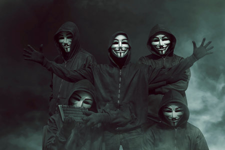Group of hacker with mask in hoodies against dark background
