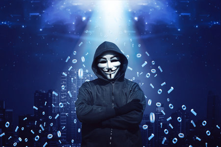 Hooded man with mask standing against binary code in backgroundのeditorial素材