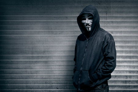 Anonymous man on grey shutter door backgroundのeditorial素材
