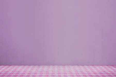 Pink cloth on the table against pink wall backgroundの写真素材