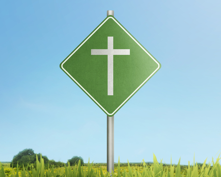 Traffic road with christian cross on meadow fieldの写真素材