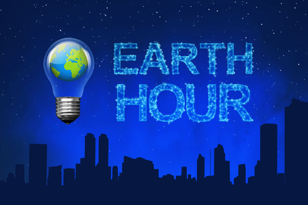 Blue planet on light bulb with Earth Hour message on the skyの写真素材