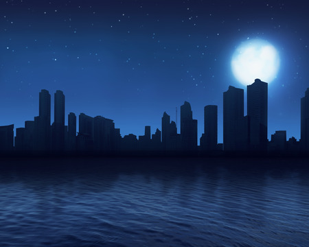 Modern cityscape with its reflection from river at nightの写真素材