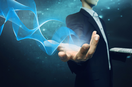 Business man give the hand for help using laptop. Technology conceptの写真素材