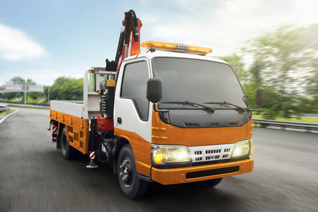 Tow truck patrolled on highway at cityの写真素材