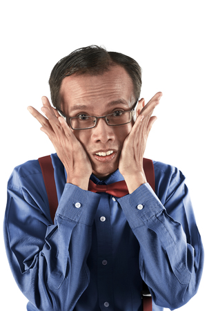 Young asian nerd man with funny expression isolated over white backgroundの写真素材