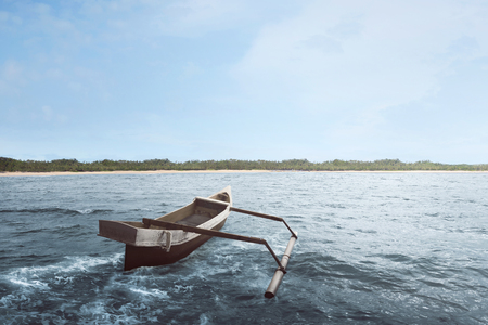 Wooden boat float with wave water on the seaの写真素材