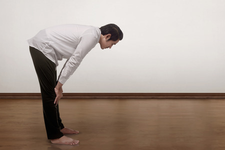 Portrait of asian muslim man praying to god inside the roomの写真素材