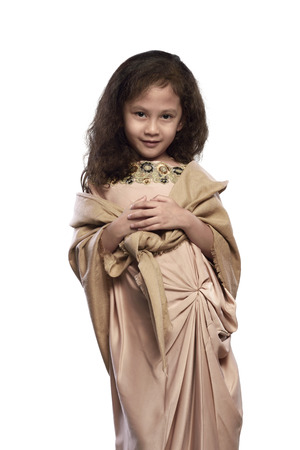 Portrait of asian muslim girl with traditional dress isolated over white backgroundの写真素材