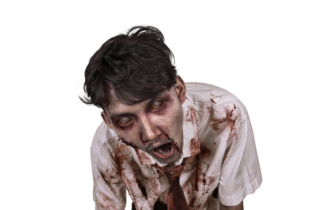 Close-up of horrible asian zombie man isolated over white backgroundの写真素材