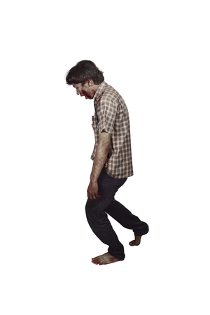 Side view of scary asian zombie with wounded face isolated over white backgroundの写真素材