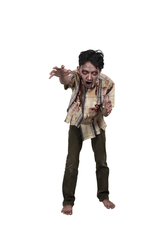 Portrait of asian zombie man with hand to reach you isolated over white backgroundの写真素材