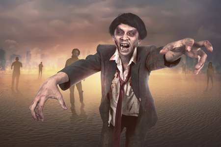 Crowd of scary asian zombies walking around on the burning cityの写真素材