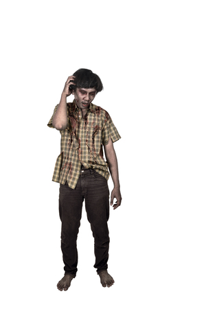 Portrait of asian zombie man with confused expression standing isolated over white backgroundの写真素材