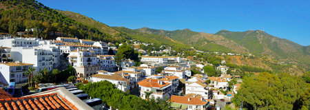 View of little village with green landscape the hill in Mijas, Spainの写真素材