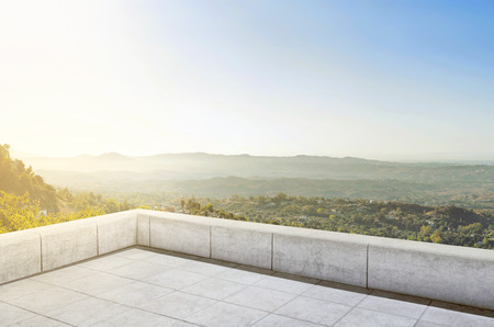 Terrace tiles with green panorama view and little village at sunriseの写真素材