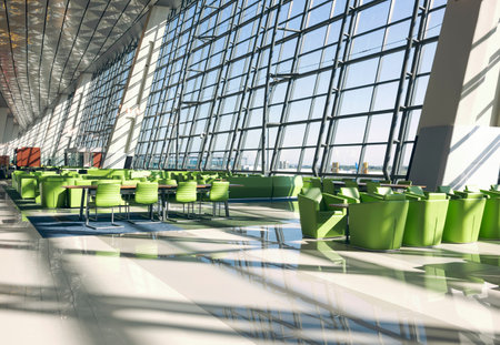 Departure lounge with green sofa and table in the airportのeditorial素材