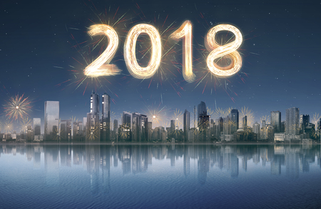 Cityscape view with 2018 firework sparkle at night. Happy New Year 2018の写真素材