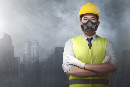 Attractive asian architect with hard hats and uniform on city backgroundの写真素材