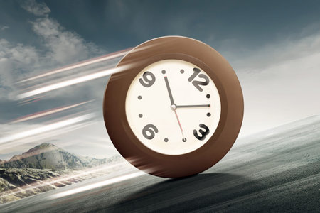 Analog clock rolling uphill to the top of mount