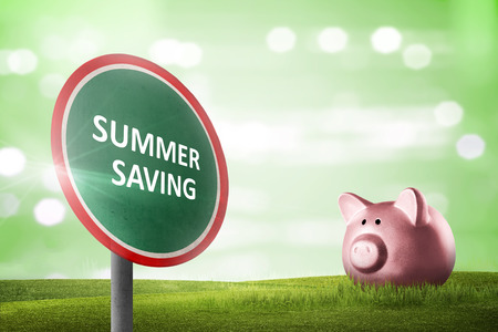 Road sign with Summer saving message with green backdrop. Summer saving conceptの写真素材