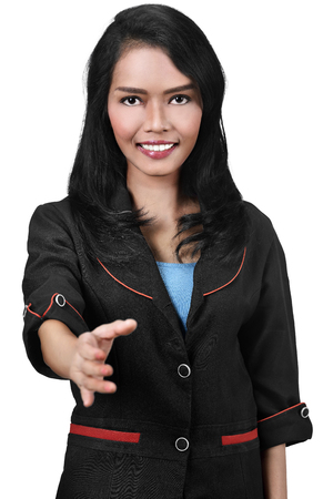 Attractive asian business woman offering a handshake isolated over white backgroundの写真素材
