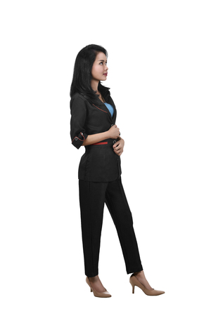 Image of asian business woman standing while looking up posing isolated over white backgroundの写真素材
