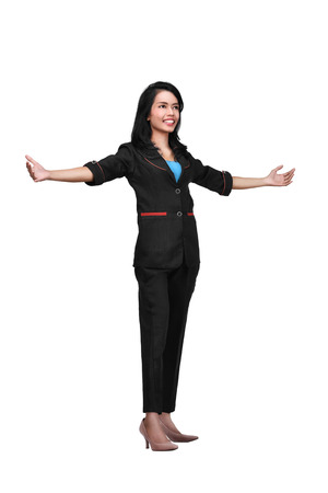 Portrait of asian business woman standing with open hand posing isolated over white backgroundの写真素材