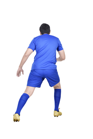 Rear view of asian football player in action isolated over white backgroundの写真素材