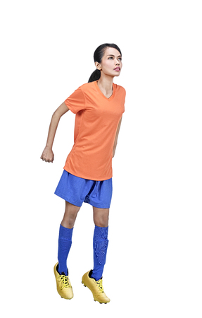 Portrait of asian soccer player woman in action isolated over white backgroundの写真素材