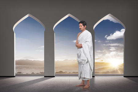 Handsome asian muslim hajj praying inside the mosqueの写真素材