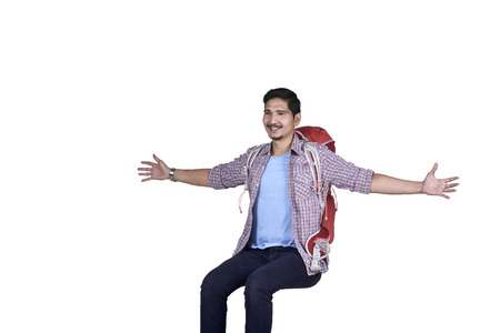 Images of asian traveler man enjoying with open hand isolated over white backgroundの写真素材