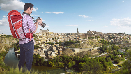 Young asian traveler want to taking a photos on the cityの写真素材