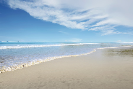 View of blue ocean with wave on the beachの写真素材