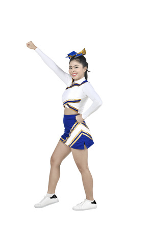 Cute asian cheerleader in action isolated over white backgroundの写真素材