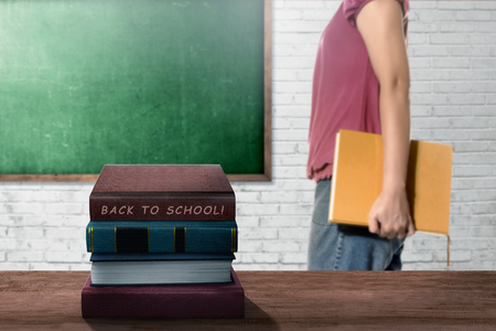 College student woman with back to school sign on the classの写真素材