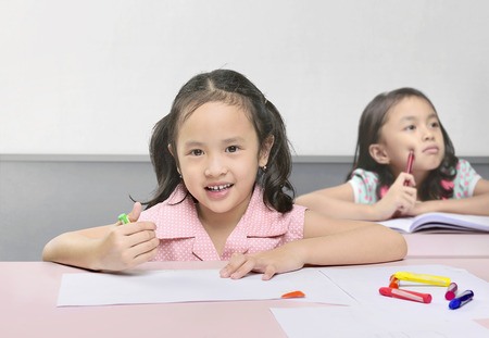 Cute asian kids learning on the classroomの写真素材