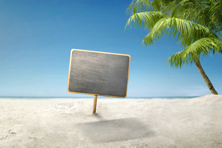 Empty board for copyspace area on the sandy beach. Summer conceptの写真素材