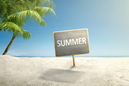Empty board with summer text on the sandy beach. Summer conceptの写真素材