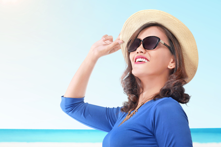 Beautiful asian woman with hat on summer vacation. Summer conceptの写真素材