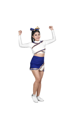 Happy asian cheerleader in action posing isolated over white background