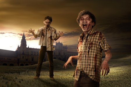 Scary zombies with old building background. Halloween conceptの写真素材