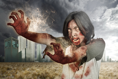 Spooky zombie man with wounded face hauted the city. Halloween conceptの写真素材
